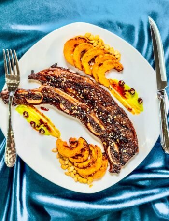 Short Ribs on a plate with delicata squash